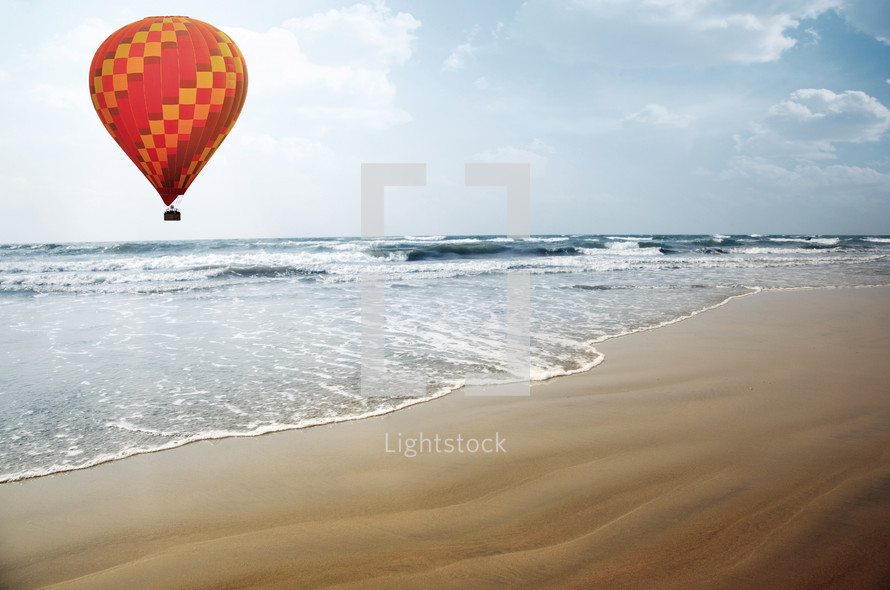 hot air balloon over a beach 
