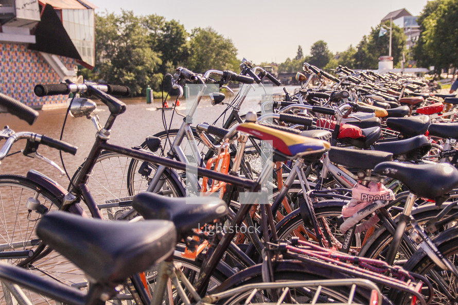 bicycles parked along a harbor in The Netherlands 