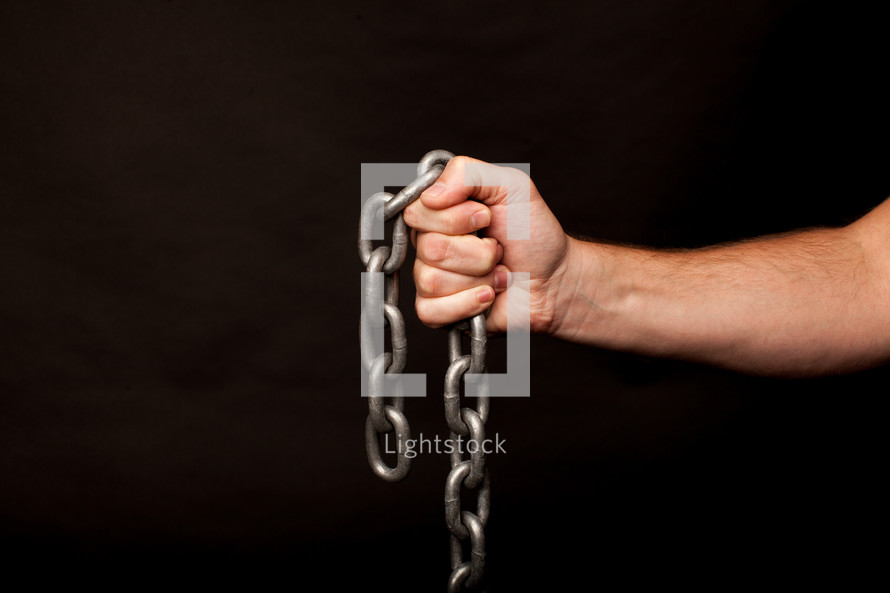 hand holding a chain 