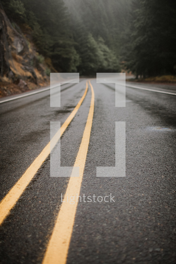 wet pavement on a road 