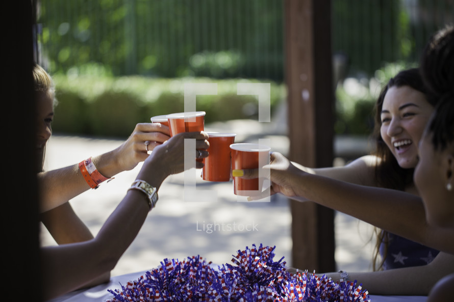 women toasting at a July 4th party 