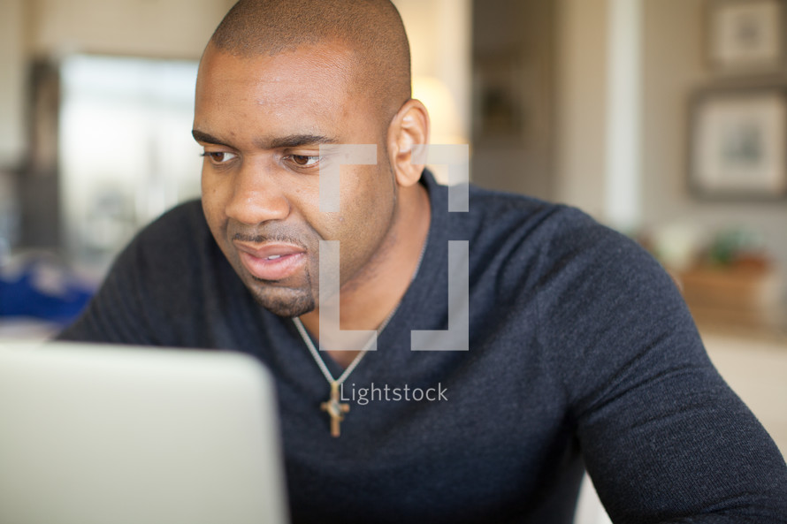 Man looking at a computer monitor.