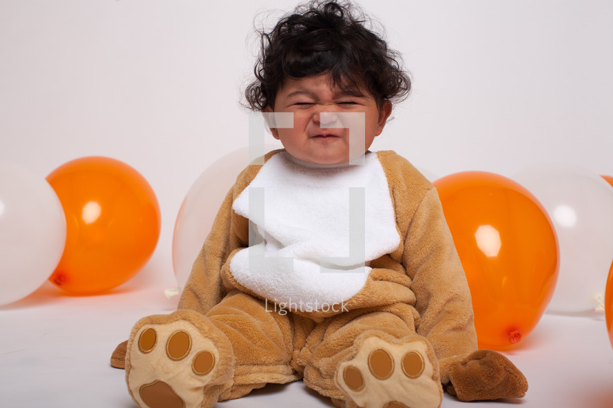 a toddler boy in a Halloween costume 