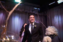 a bridesmaid and groomsman at a wedding reception 