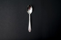 spoon on a black background 