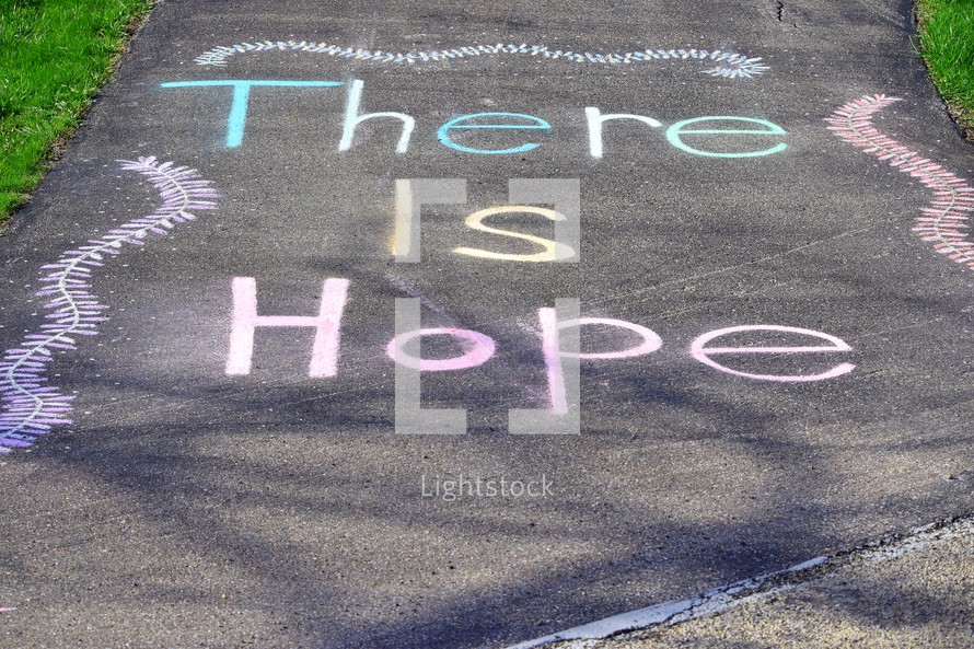 An uplifting chalk art message "There is Hope" on our driveway