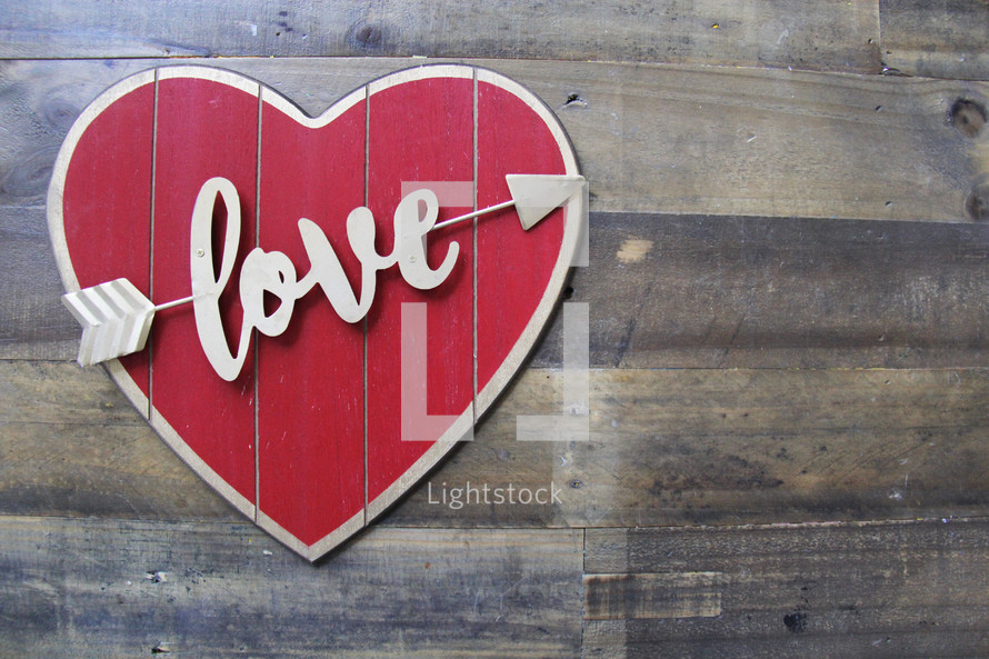 love heart sign on wood background 