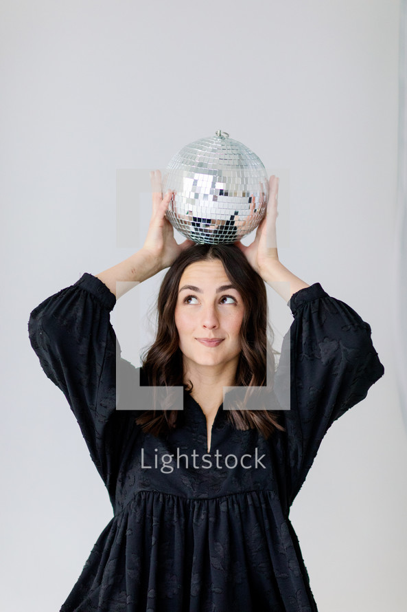 Young lady with a disco ball 