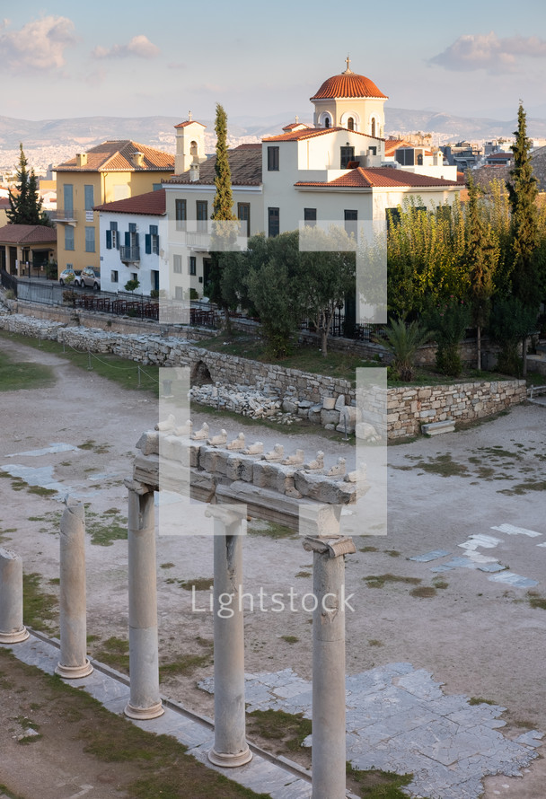 columns at a ruins site and church building 