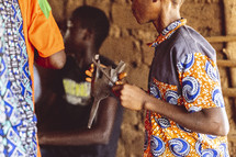 Christian African people singing and dancing in a small village church in the Ivory Coast in west Africa
