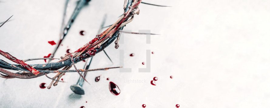 Crown of thorns with blood dripping, nails on stone. Christian concept of Jesus Christ suffering, passion. 
