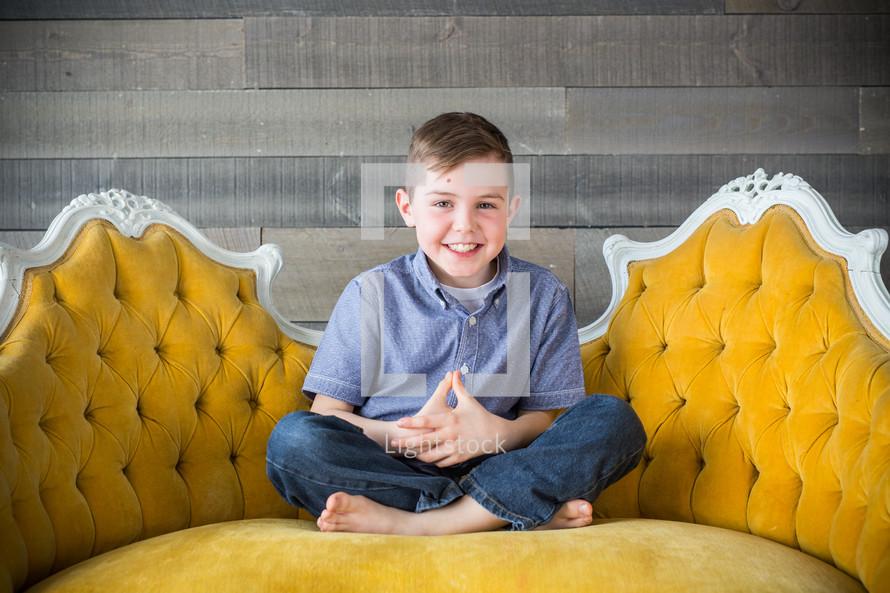 a child sitting on a couch 