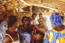 Christian African people singing and dancing in a small village church in the Ivory Coast in west Africa