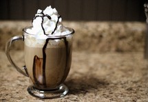 mug with whip cream and chocolate syrup 