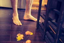 bare feet and a messy kitchen floor
