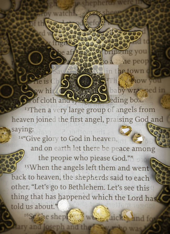 Close-up scripture with angels and jewels. Luke 2:13-15