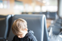 a boy child in a waiting area 