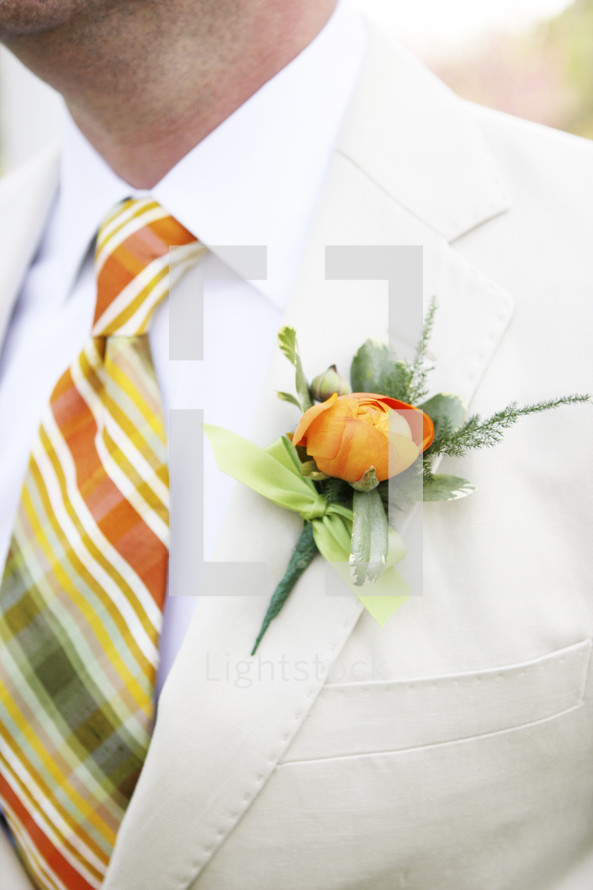 boutonniere on groom at wedding