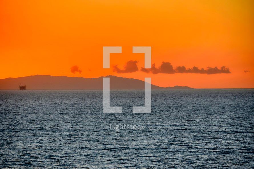 distant Catalina Island under an orange sky 