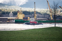 barge and tug boat on a river 