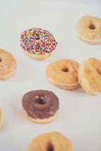 sprinkled donut and donuts on a white background 