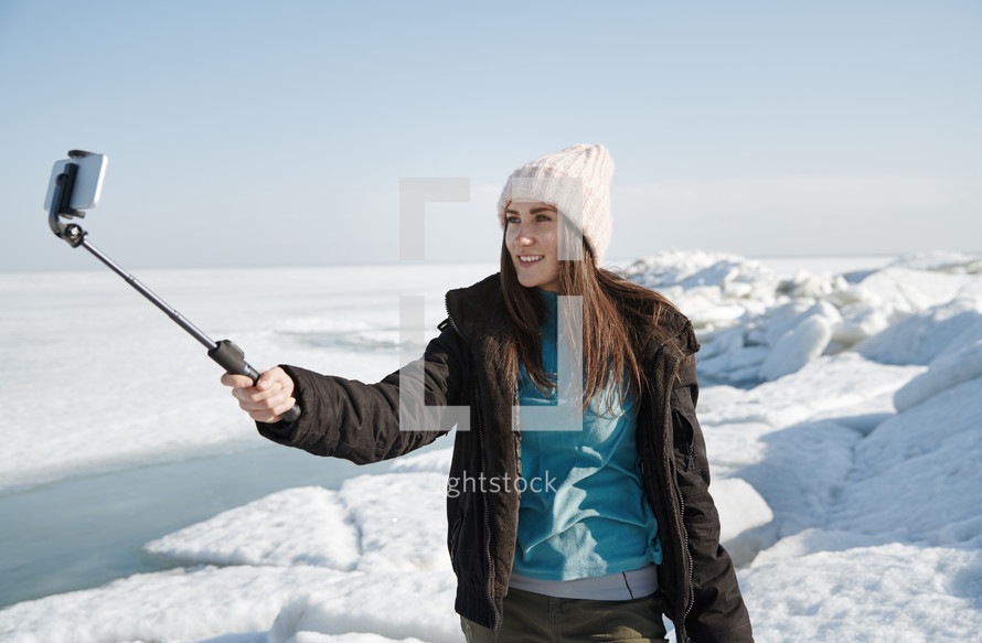 a woman taking a selfie in winter 