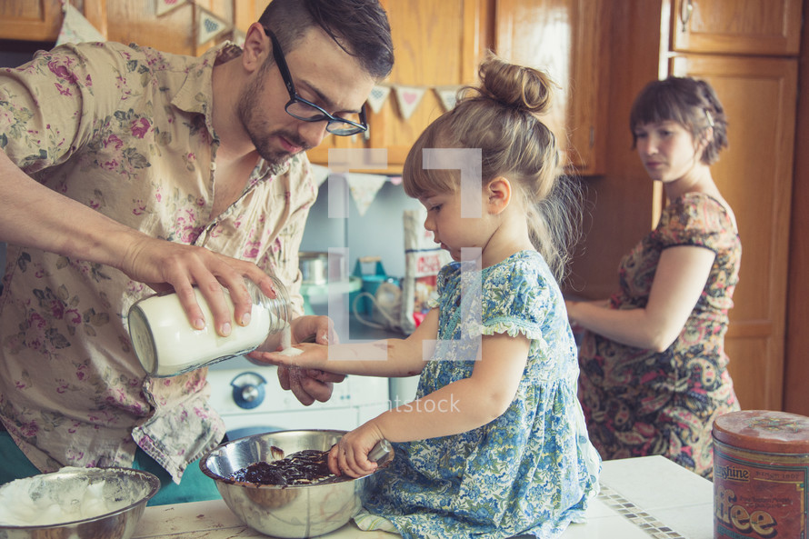 a family baking together in the kitchen 