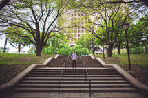 man standing on outdoor stairs 