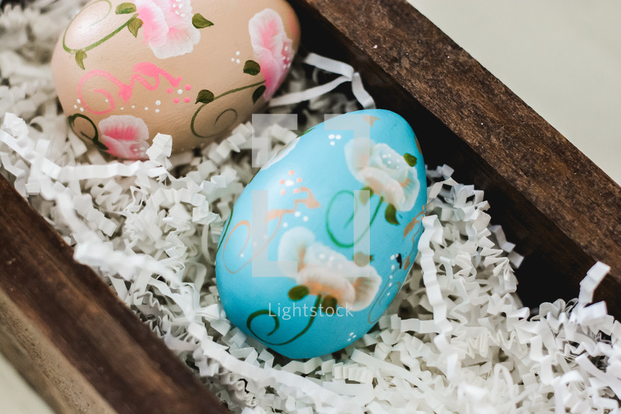 decorated Easter eggs in a wooden box 