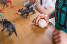 kids playing with dragons and dinosaurs 