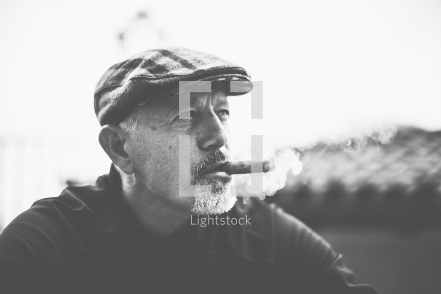 a man smoking a cigar 