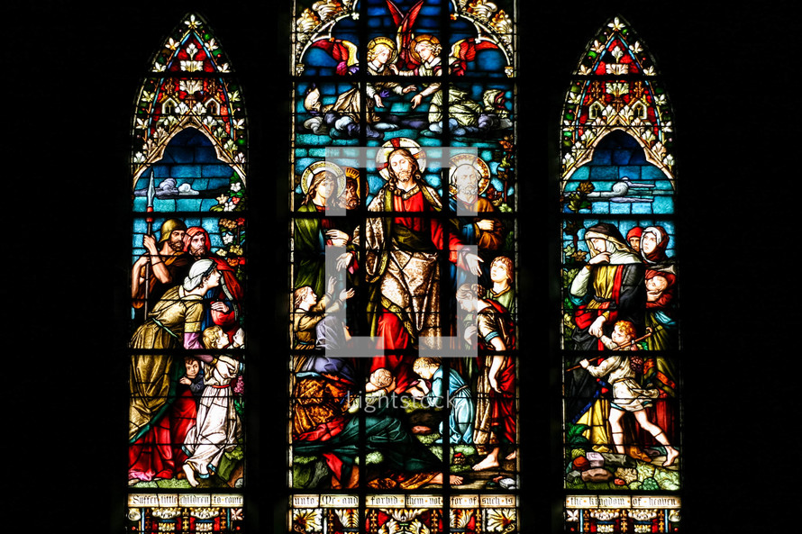 stained glass windows of Jesus in a church 