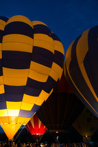 A gathering of people at a hot air balloon festival.