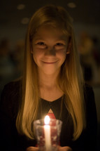 girl child at a Christmas Eve service 