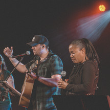 worship leaders playing music during a worship service 
