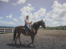 A man riding a horse. 