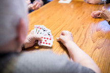 playing cards around a table 