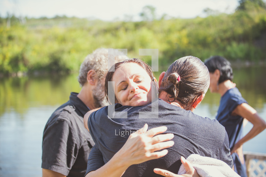 hugging after being baptized 