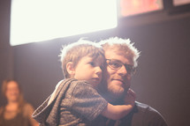 a son hugging his dad 