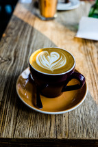 heart shape creamer in a latte 