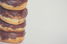 stacked donuts with chocolate icing 