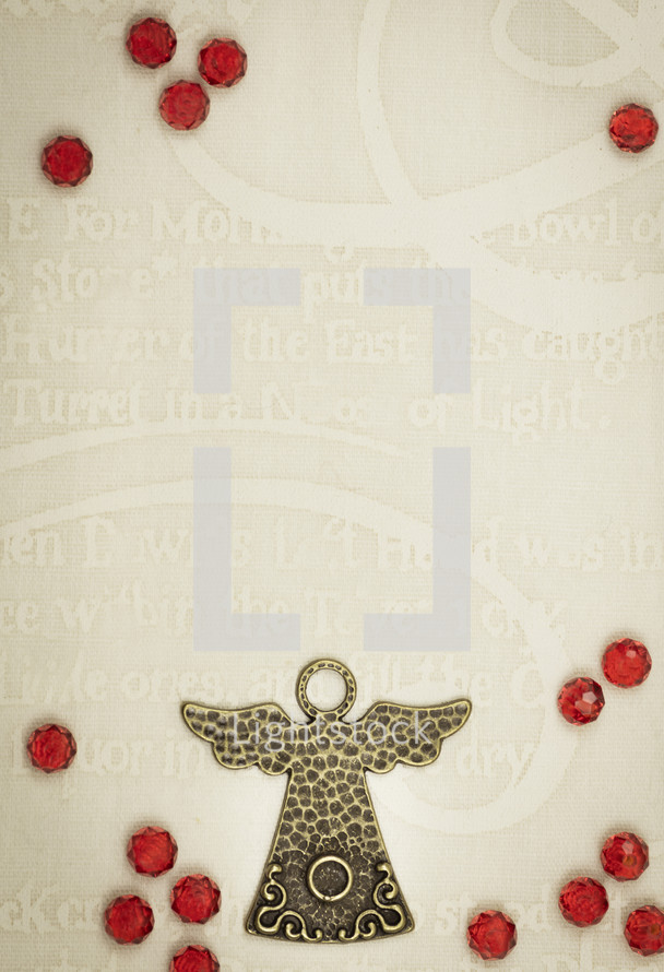 Christmas Angel on creamy text background with rubies