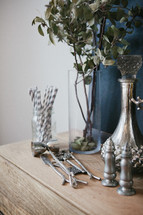 silver trinkets on a table 