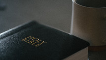 Holy Bible cover and coffee mug