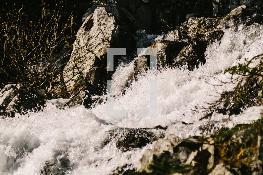 rushing water in a fast moving stream 