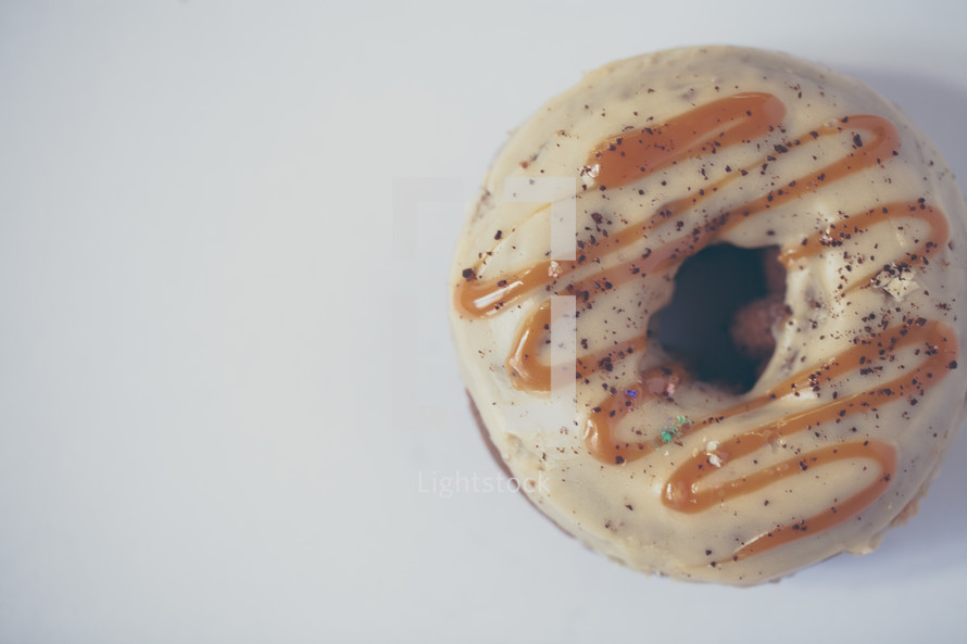 caramel drizzle on a chocolate donut 