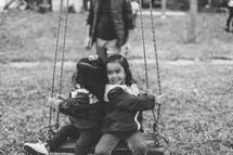 children on a swing 