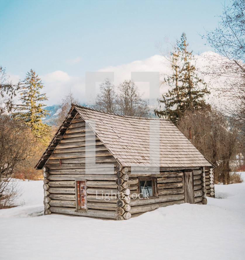 log cabin in snow 