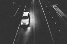 car driving on a street at night