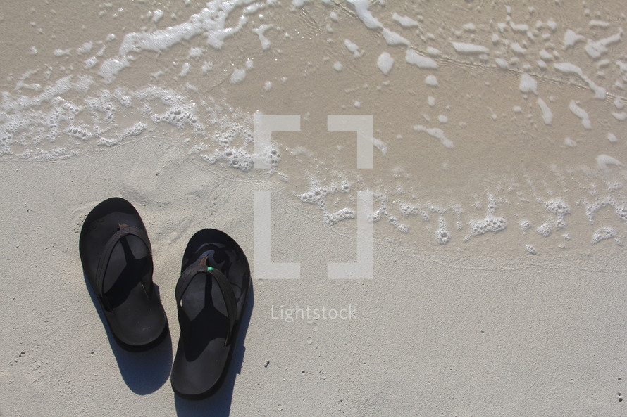 Flip flops on a beach 